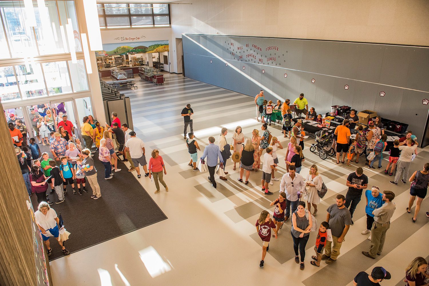 FILE PHOTOS — Attendees flood into Orin C. Smith Elementary during the grand opening in 2019.